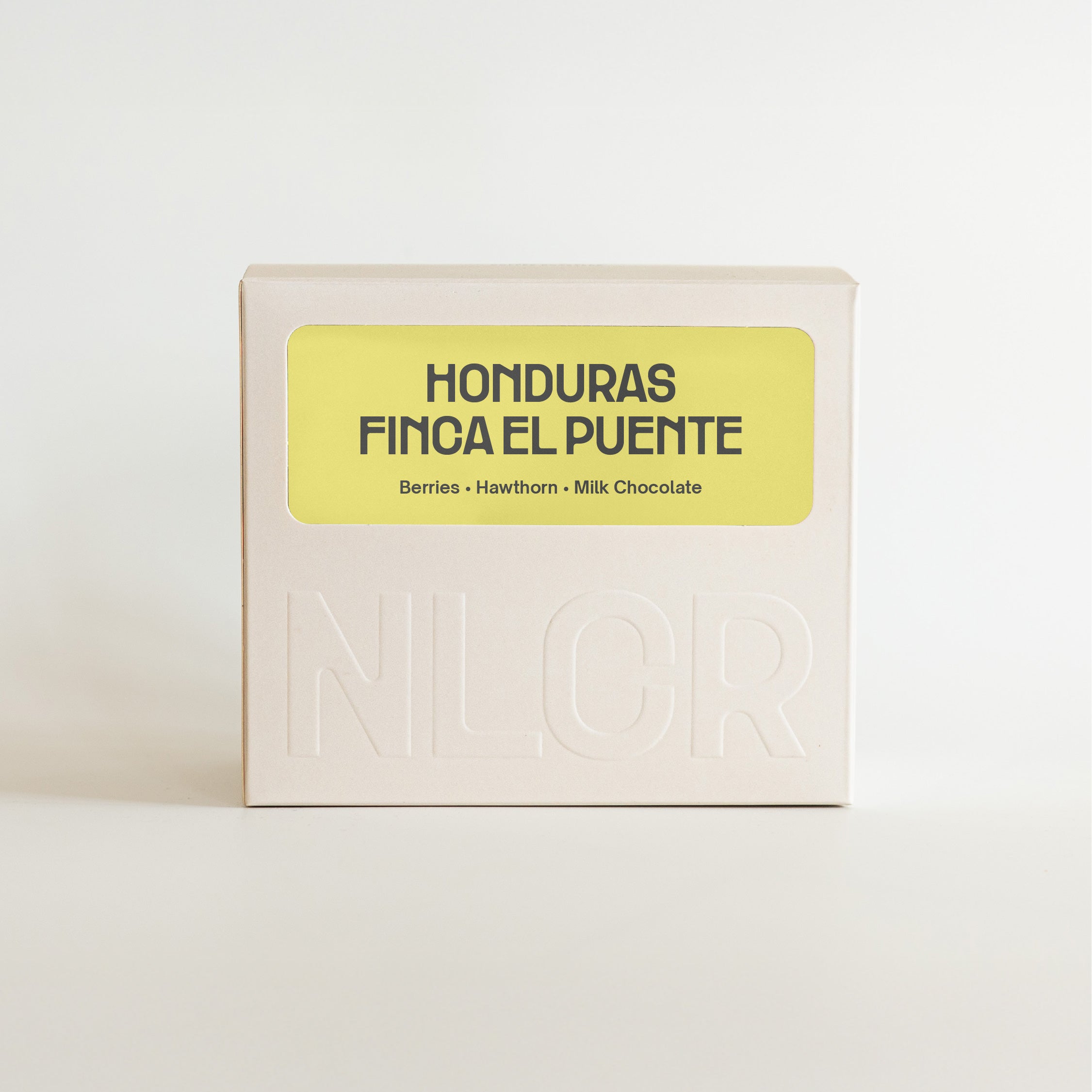 Specialty Coffee packaging with 'Honduras Finca El Puente' text on a light background