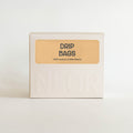 Box of NLCR drip bags specialty coffee on a white background