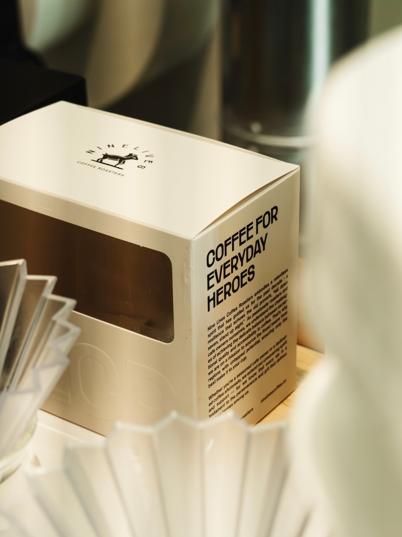 Nine Lives Coffee Roasterscoffee packaging with 'Coffee for Everyday Heroes' text in their Georgetown Penang roastery 